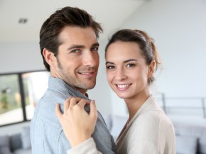 Portrait of smiling couple relaxing at home