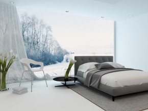 Modern cool bedroom interior overlooking a garden