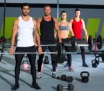 gym group with weight lifting bar crossfit workout