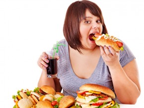 Woman eating fast food.