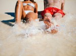 White-young-couple-relaxing-on-beach