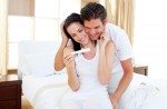 Enamoured couple finding out results of a pregnancy test