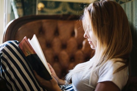 concentrated-woman-with-book-home